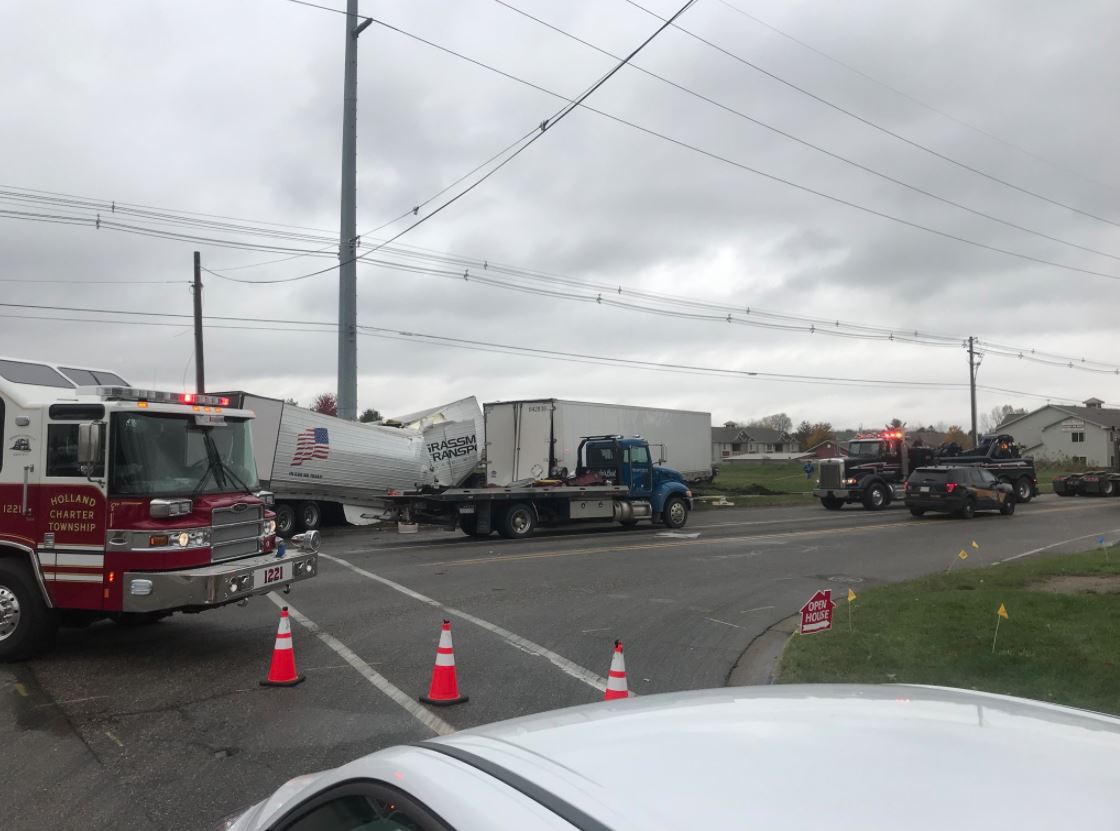 Semi trucks collide, 1 person killed in Holland crash